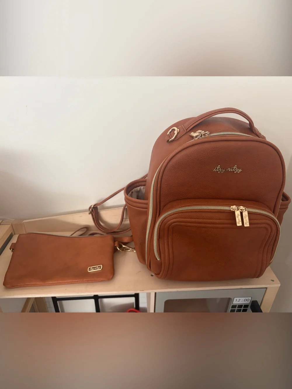 Itzy Ritzy Mini Boss Diaper Bag + Boss Pouch Bundle | Cognac Faux Leather